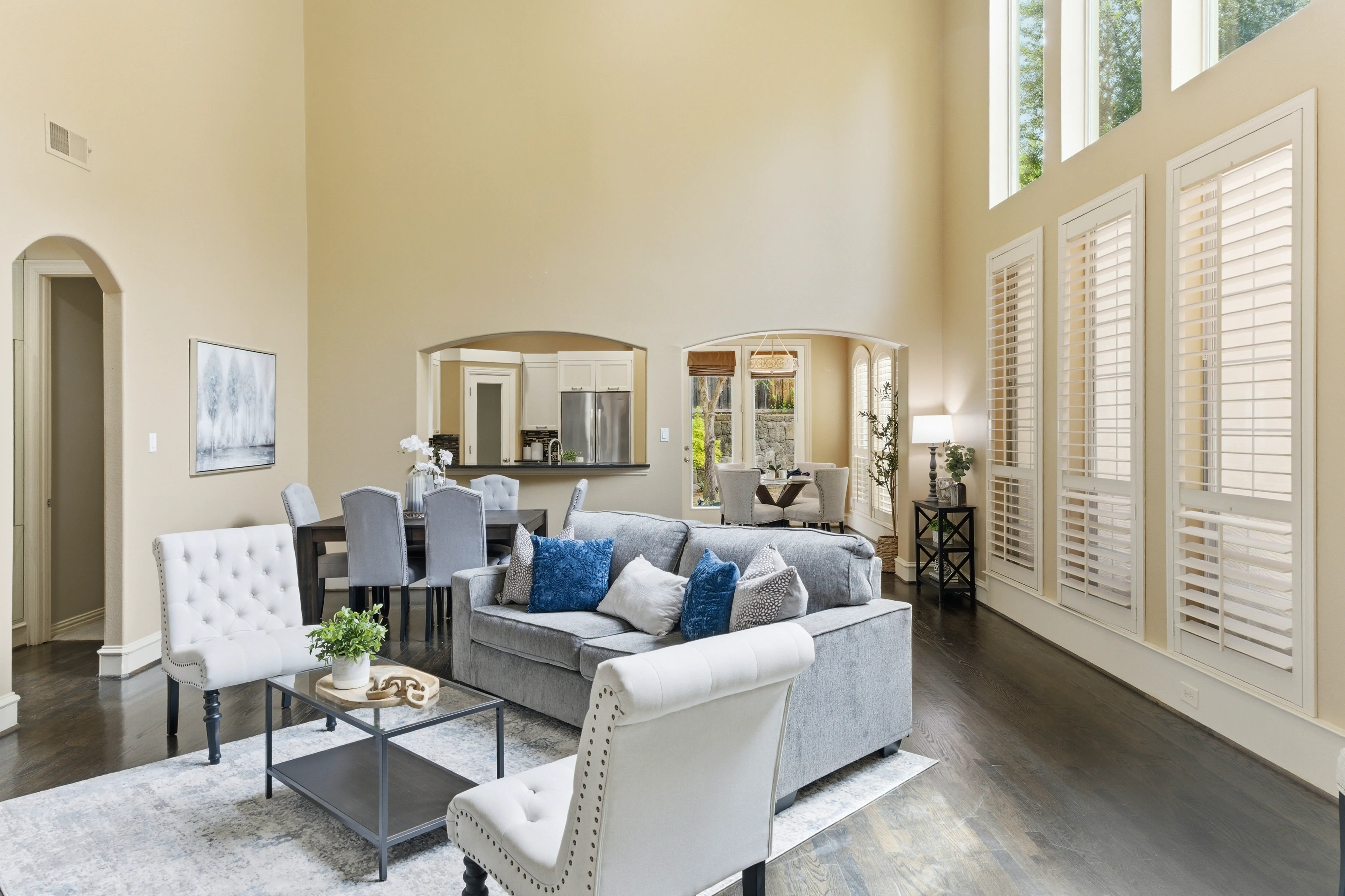 Open living area with soaring ceilings and natural light