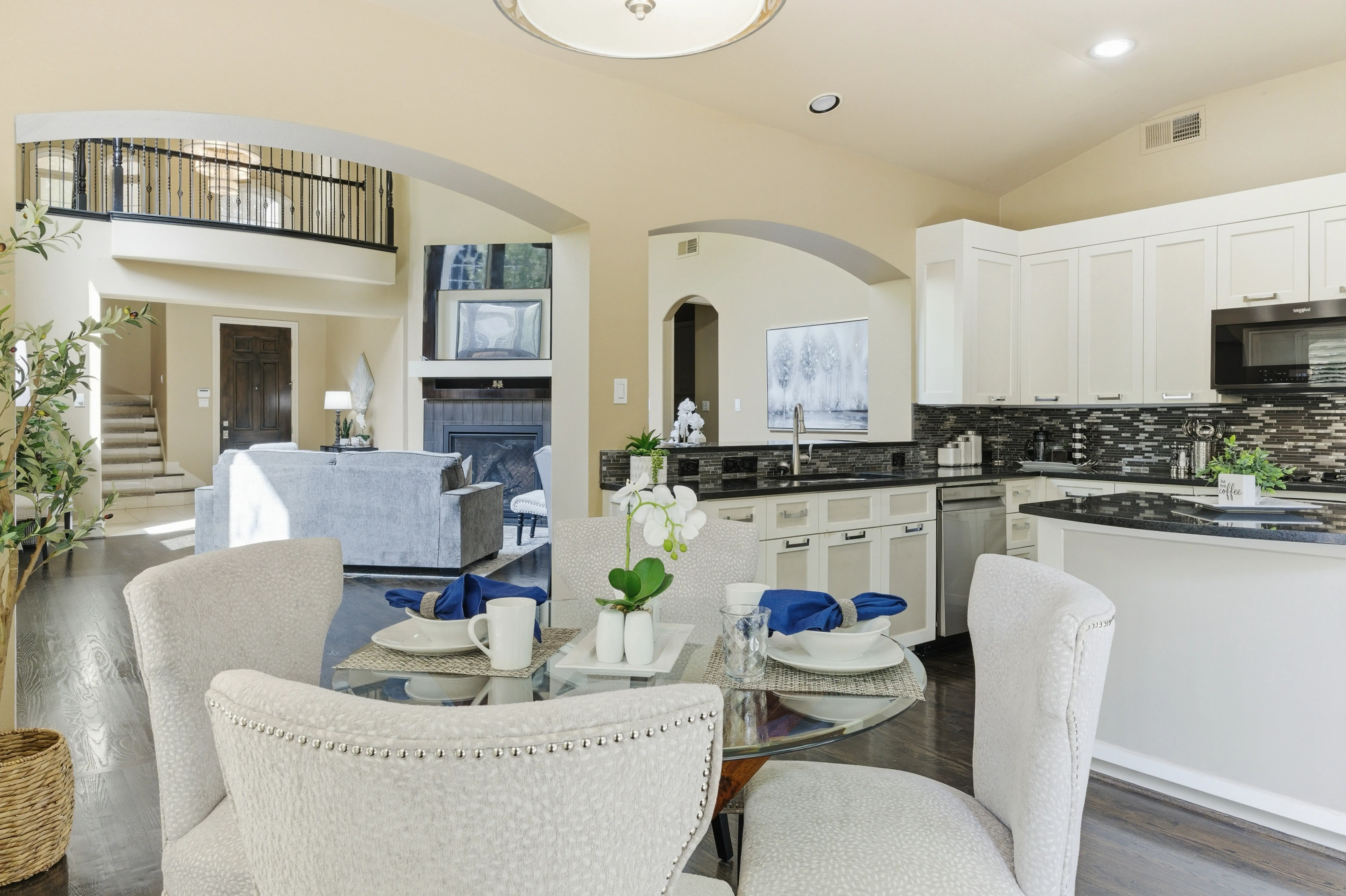 Open view from breakfast nook into kitchen and living room