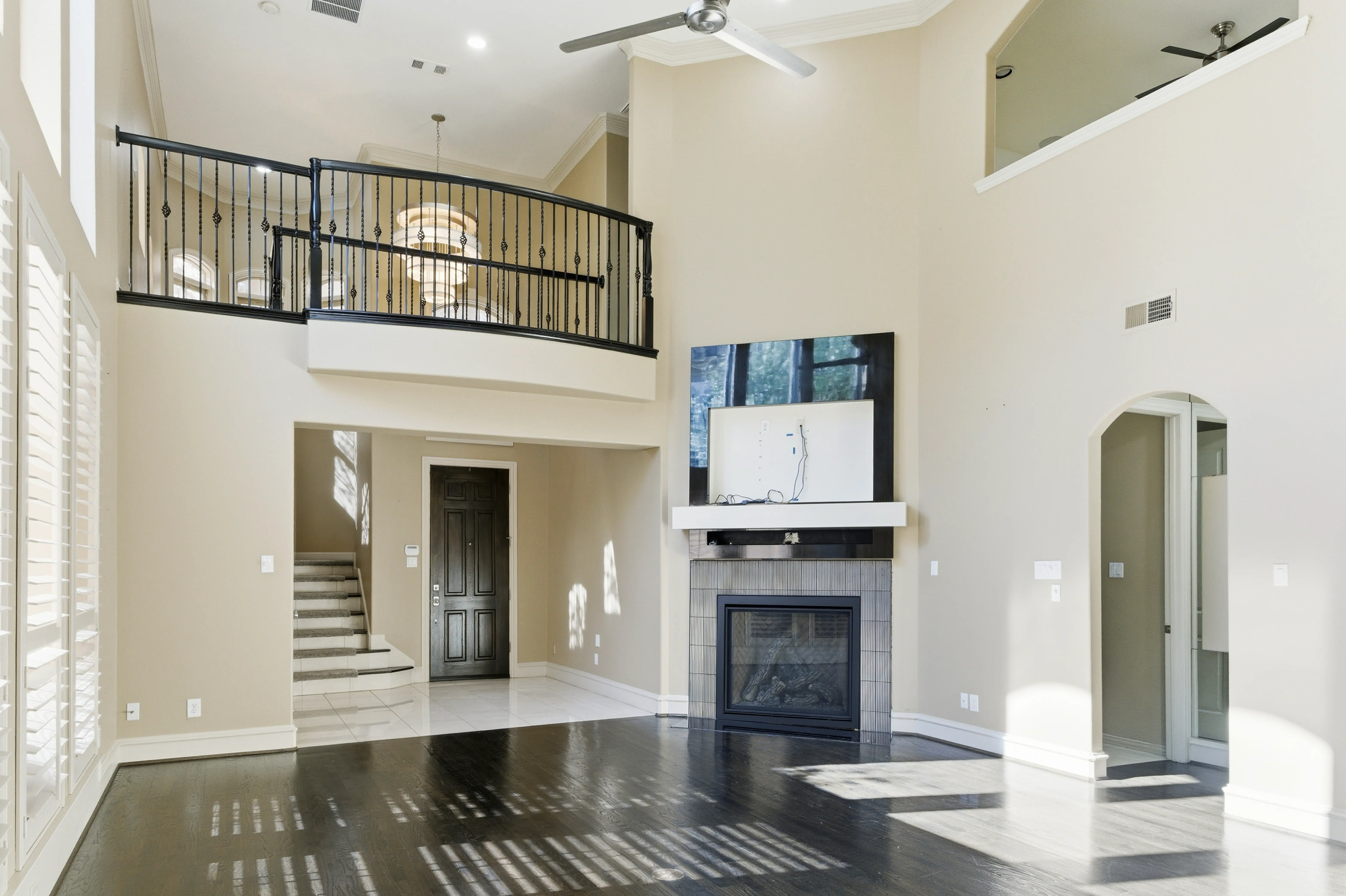 Open living area with soaring ceilings and natural light
