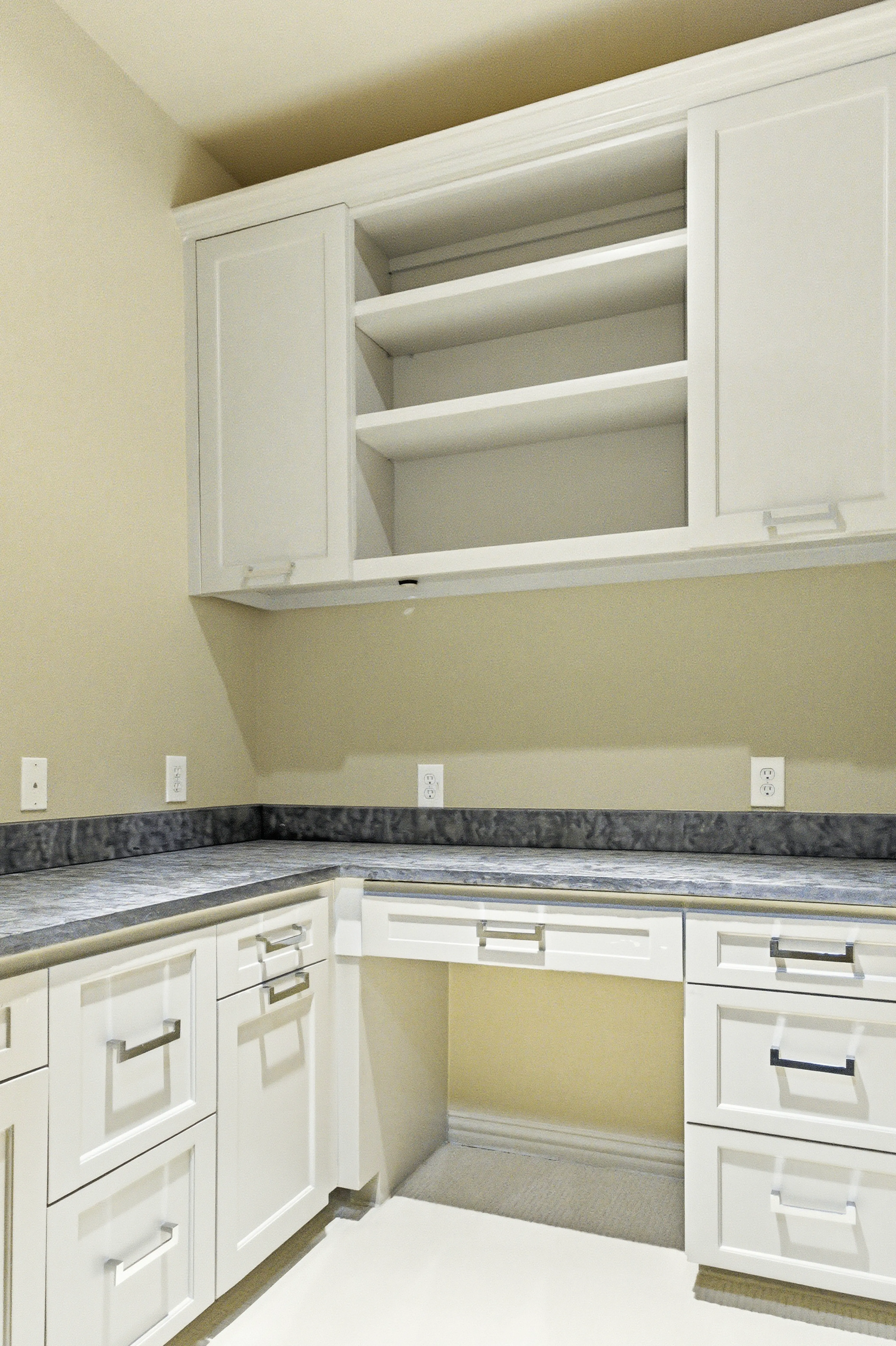 Built-in desk area with cabinetry