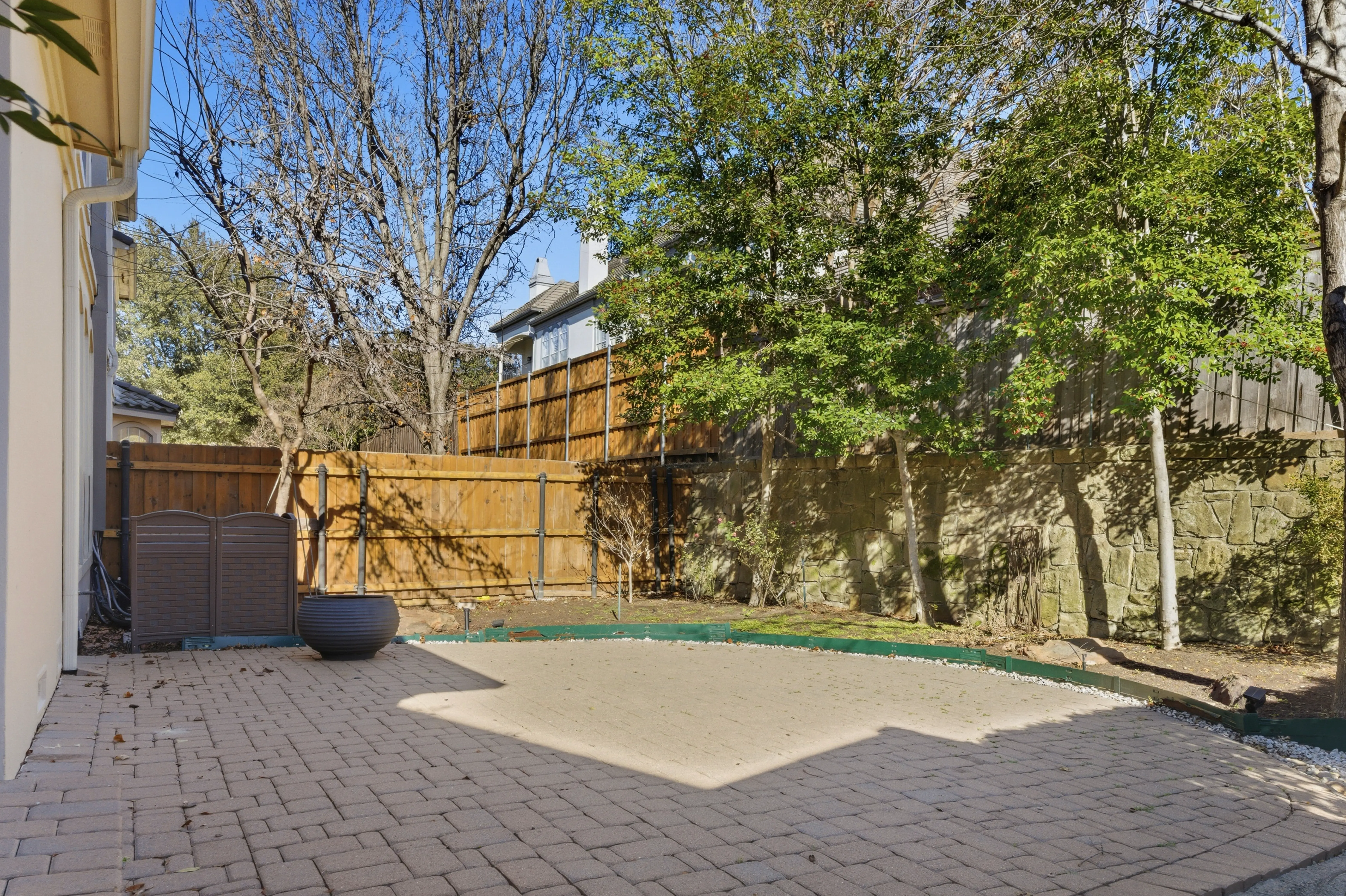 Backyard patio with privacy fence